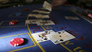 SA Gaming live dealer table with multi-camera setup showing cards and croupier